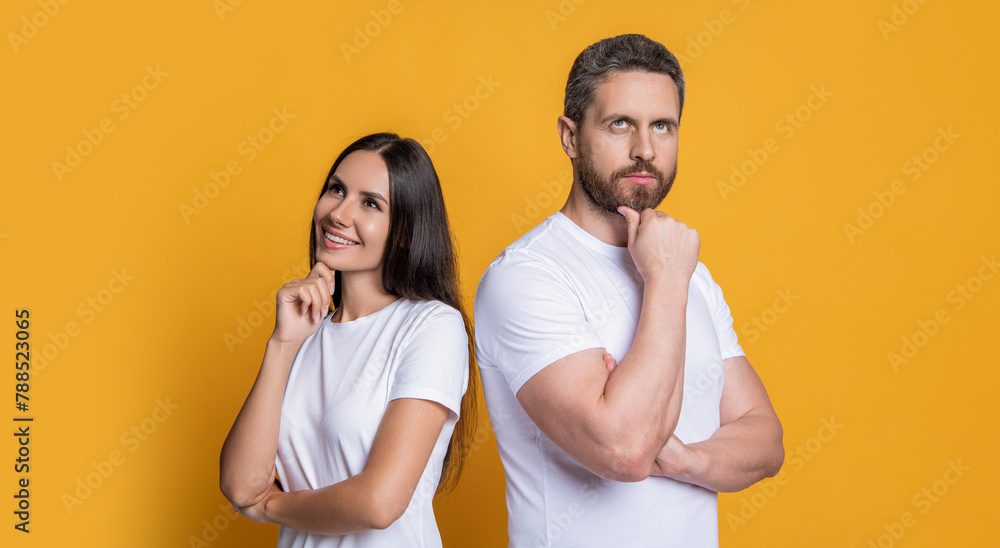 Wall mural Couple of millennial man and woman isolated on yellow. Man and woman in white tshirt. Family portrait. Millennial couple with casual style. Stylish friends. Family couple. Life coach - Wall murals