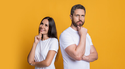 Couple of millennial man and woman isolated on yellow. Man and woman in white tshirt. Family portrait. Millennial couple with casual style. Stylish friends. Family couple. Life coach - 788523065