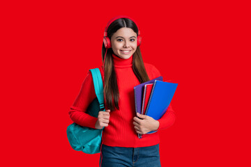 Concept of education. Teen girl student isolated on red. September 1. High school education. Knowledge through eLearning. Teen girl hold workbook. Back to school. Knowledge day. Online assessments