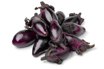 Heap of fresh purple mini eggplants isolated on white background close up