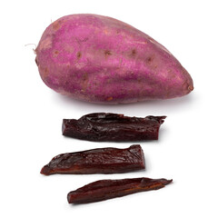 Dried sweet purple potato slices and fresh purple potato isolated on white background close up