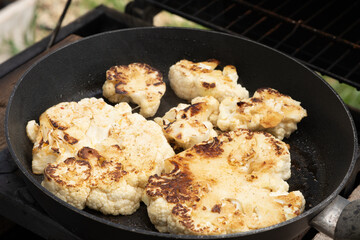 Grilled or roasted cauliflower in a pan as a healthy alternative to meat - 788531443