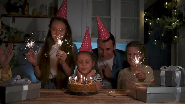 Happy family concept.big family holiday at home.birthday with family.celebration with cake and candles.emotions of joy at holiday.blowing out birthday candles.birthday at home.happy family on holiday