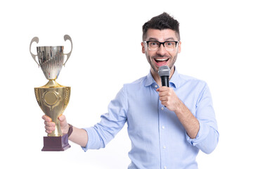 Businessman celebrate victory on business ceremony isolated on white. Successful businessman man holding champion cup and microphone. Business champion success. Business success. Got prize