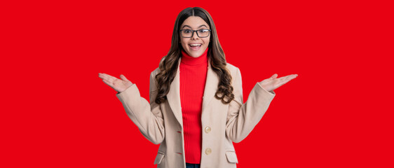 Teen trend for fall season. Style fashionable girl. Teen girl wearing fall coat isolated on red. Copy space advertisement. Teen girl in stylish autumn coat. Fall fashion style. Making the choice - 788537238