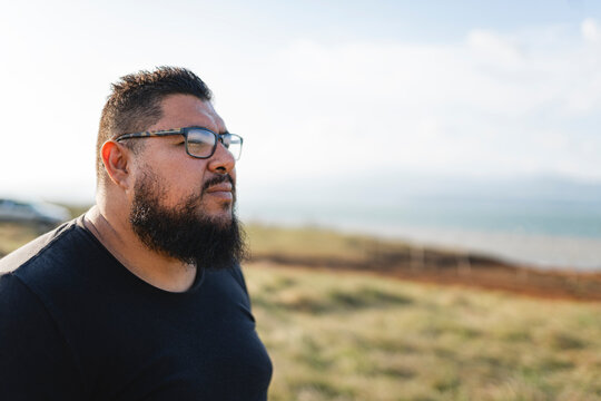 Close-up portrait of a serious plus-size man