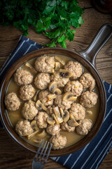 Delicious homemade swedish meatballs with mushroom cream sauce. Small depth of field. Top view. - 788554815