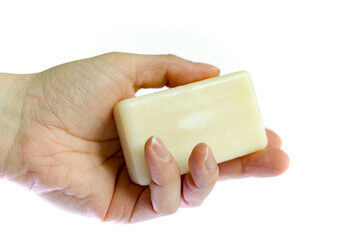 hand holding a  soap bar , isolated white background