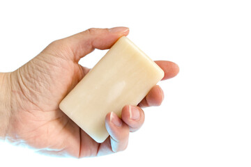 hand holding a  soap bar , isolated white background