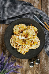 Fried dumplings (pierogi) with spinach. - 788556819