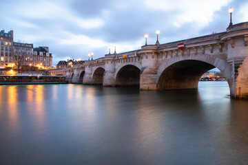 Fototapeta na wymiar bridge Pont Neuf and Seine river with old houses, Paris, France, toned