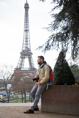handsome man tourist with camera in Paris