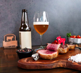 juicy cuts of picaña meat, accompanied by blonde beer