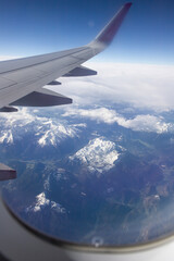Obraz premium aerial view of snow covered mountain peaks in the Alps