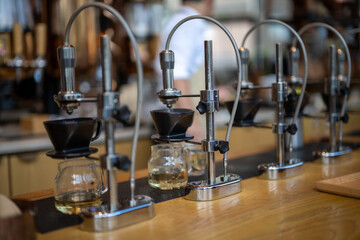 An array of sophisticated manual coffee brewing stands poised for crafting the perfect cup in a...