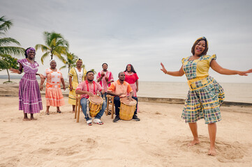 Couple of friends dancing to the rhythm of Punta music, on a Guatemalan Caribbean beach.