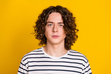 Portrait of stylish positive handsome teenager young man attractive model wavy curls hairstyle...
