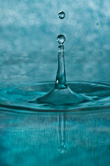 close-up shot of a bounce of a water droplet