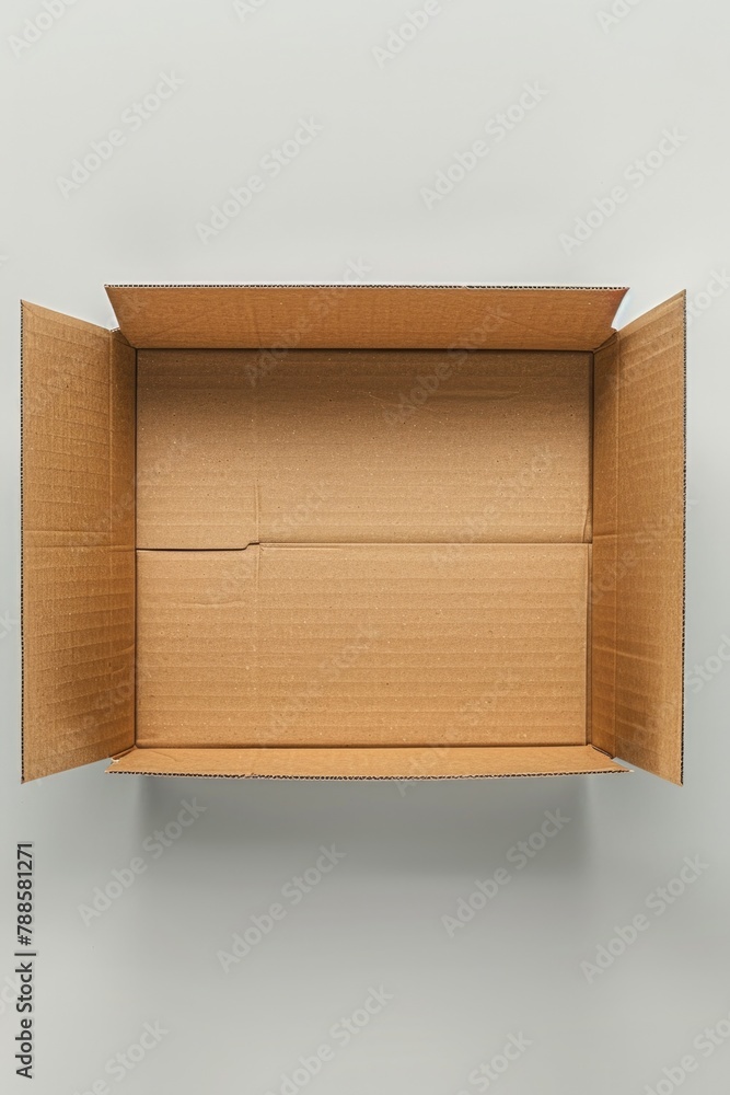 Aufkleber A simple image of an open cardboard box on a plain surface. Perfect for packaging or storage concepts
