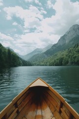 Scenic view of a boat on a tranquil lake with majestic mountains in the background. Ideal for travel and nature concepts