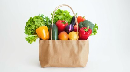 Fresh vegetables in a brown paper bag, perfect for healthy eating promotions