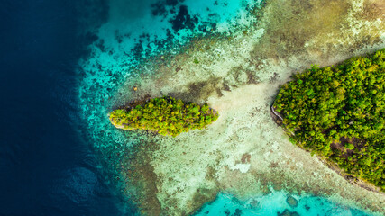 Drone, tropical island and ocean outdoors by jungle and nature travel for planet adventure. Aerial view, Raja Ampat and location in Indonesia for vacation, forest and sea or water for peace or calm