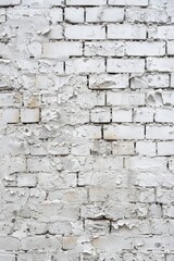 A close-up image of a white brick wall with peeling paint. Perfect for backgrounds or textures