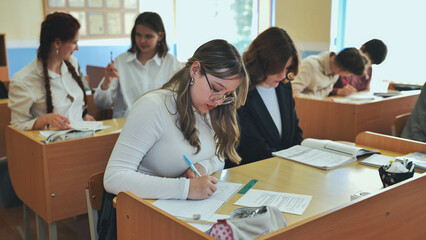 High school students sitting at a desk.