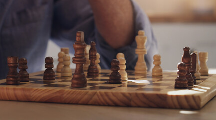 Game, hands and play of chess, table and board of wood, strategy and challenge for person, house...
