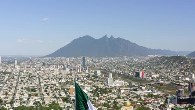 Aerial Descending Shot Of Tall Flag At Mirador Del Obispado In City Against Sky - Monterrey, Mexico