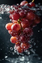A bunch of ripe red grapes is suspended mid-air, enveloped by a cascade of effervescent water bubbles that create a refreshing and dynamic scene