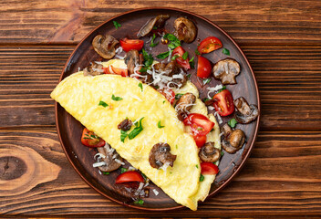Omelette stuffed with mushrooms , tomatoes and parsley