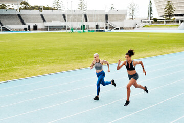 Fototapeta premium Running, track and women with fitness, training for competition and wellness with endurance. People, runner and athletes with hobby and progress with cardio and breathing with exercise and practice