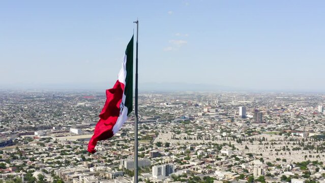 Aerial Panning Shot Of Flag At Mirador Del Obispado In City Against Sky On Sunny Day - Monterrey, Mexico