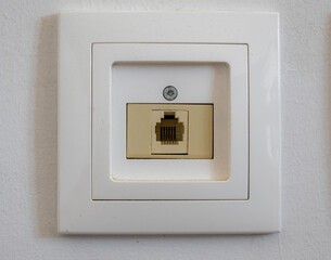 White socket for internet cable close up photo.
