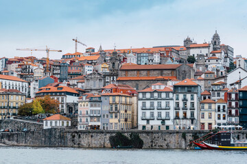 Porto, Skyline view of the old town of Portugal on the Douro river. Travel and monuments of Portugal. Old historic houses of Porto. Rows of colorful buildings in traditional architectural style. - 788629210