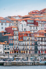 Porto, Skyline view of the old town of Portugal on the Douro river. Travel and monuments of Portugal. Old historic houses of Porto. Rows of colorful buildings in traditional architectural style. - 788629421