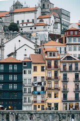 Porto, Skyline view of the old town of Portugal on the Douro river. Travel and monuments of Portugal. Old historic houses of Porto. Rows of colorful buildings in traditional architectural style. - 788629497