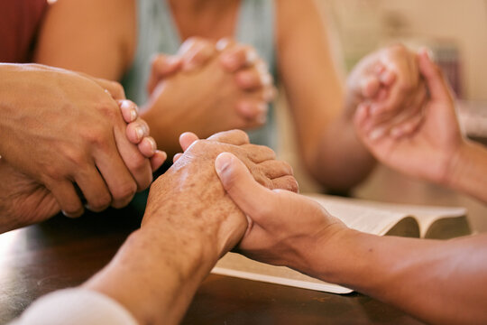 Bible, God or family holding hands in prayer for peace, trust or help, guide or spiritual healing at home. Worship, church or community praying in solidarity to Jesus Christ with support or gratitude