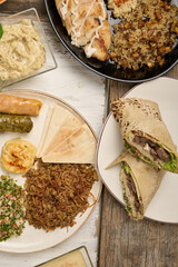 Arabic Cuisine: Middle Eastern traditional lunch. It's also Ramadan "Iftar". The meal eaten by Muslims after sunset during Ramadan. Assorted of Arabic oriental dishes. top view with close up.