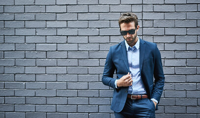 Stylish, male person and lawyer in suit with mockup space for fashion, style and trendy in outdoor. Man, pride and confidence in street for work, corporate or career in law firm in grey background