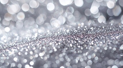 Shimmering silver glitter background with sparkling light reflections, perfect for luxurious gift...