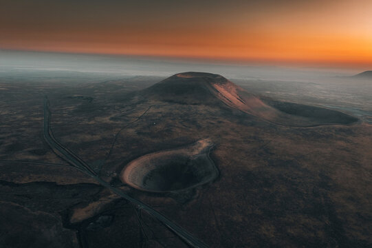 Aerial geological crater shapes view with sunset light