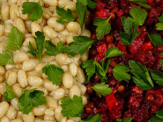 White bean stew and stewed beets with vegetables sprinkled with fresh parsley
