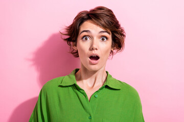 Photo of funky shocked young woman dressed green shirt big eyes open mouth isolated pink color...
