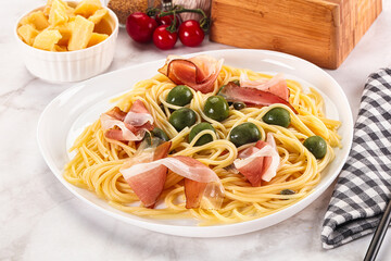 Pasta spaghetti with olives and jamon