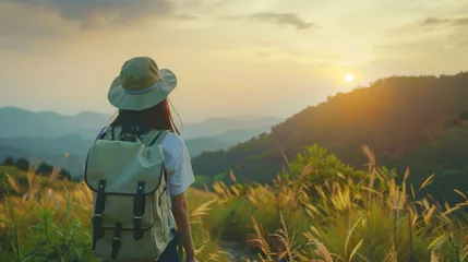 Gordijnen Asian traveler girl with backpack standing enjoy in nature during sunset. AI generated image © saifur