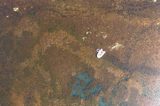 Aerial view of Brateak Krola Lake with rubber dinghy, Kampot, Cambodia.
