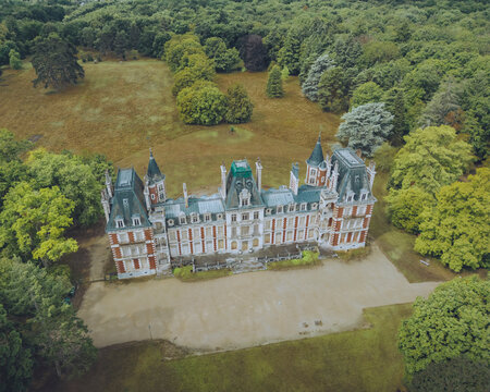 Aerial view of Chateau de Charbonniere with historic architecture and beautiful landscape, Marigny-les-Usages, France, Val de Loire.
