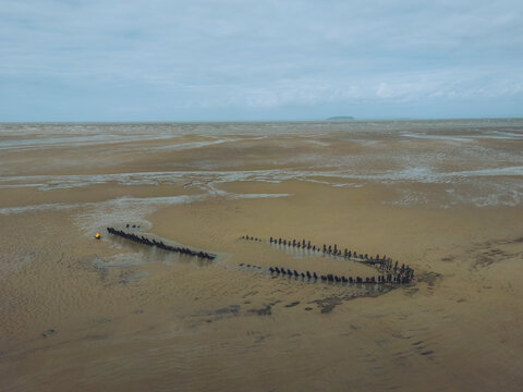 Aerial view of sandy beach with wreck of the SS Nornen, Berrow, Burnham-on-Sea, England.